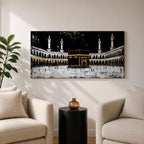 Panoramic artwork of the Kaaba at Masjid al-Haram in Mecca with black and gold accents surrounded by mosque arches and tall minarets against a dark night background.
