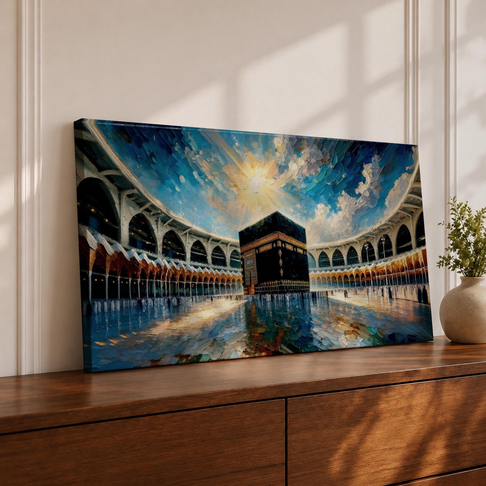 Panoramic painting of the Kaaba at Masjid al-Haram in Mecca surrounded by mosque arches reflecting on polished marble under a bright blue sky.