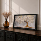 Panoramic artwork of a white blossoming tree with a flowing golden trunk and roots spreading across a textured gray background symbolizing the tree of life.