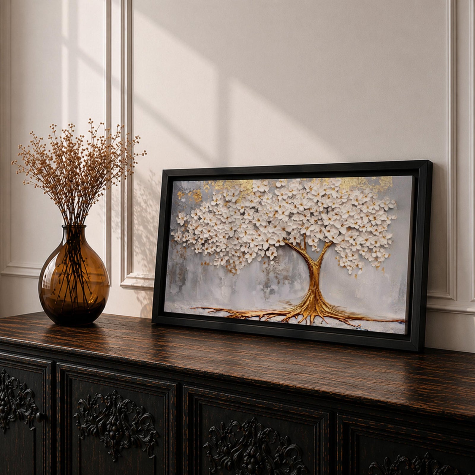 Panoramic artwork of a white blossoming tree with a flowing golden trunk and roots spreading across a textured gray background symbolizing the tree of life.