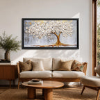 Panoramic artwork of a white blossoming tree with a flowing golden trunk and roots spreading across a textured gray background symbolizing the tree of life.