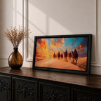 Panoramic painting of a camel caravan traveling across golden desert dunes at sunset with riders silhouetted beneath a vibrant dramatic sky.