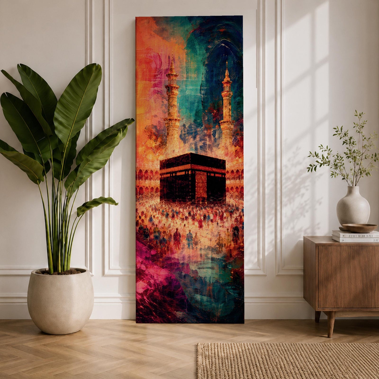 A tall narrow vertical depiction of the Kaaba in Mecca surrounded by a gathering of pilgrims, rendered in an abstract expressive style with bold layered brushwork, deep blues, warm oranges, and rich magenta tones blending into a textured composition that conveys movement, depth, and energy.