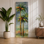 A tall narrow painting of two palm trees with slender trunks and lush green fronds, rendered in expressive brushstrokes with layered tones of green, gold, and soft red against a muted abstract background of blue and gray, creating a loose impressionistic tropical landscape composition.