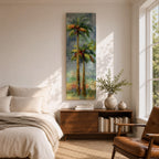 A tall narrow painting of two palm trees with slender trunks and lush green fronds, rendered in expressive brushstrokes with layered tones of green, gold, and soft red against a muted abstract background of blue and gray, creating a loose impressionistic tropical landscape composition.