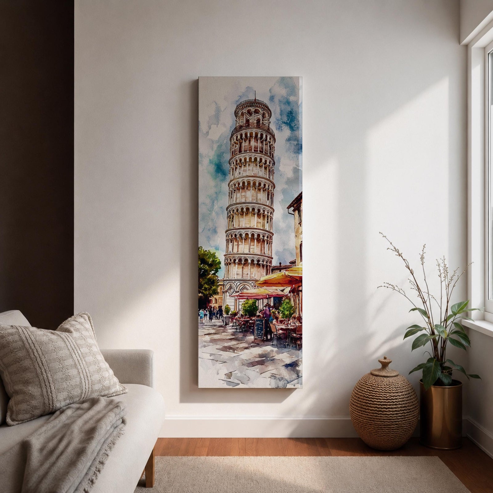 Long vertical watercolor style painting of the Leaning Tower rising above a lively Italian piazza with outdoor café tables and people walking along a stone street. The famous marble tower tilts gently against a bright sky while expressive brushstrokes capture the atmosphere of a historic Italian landmark and travel scene.