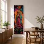 A tall narrow vertical depiction of Our Lady of Guadalupe with hands clasped in prayer, wearing a star covered mantle and framed by a radiant sunburst, surrounded by layered floral and botanical forms in a Mexican folk art style with rich contrasting tones and a dimensional textured composition.