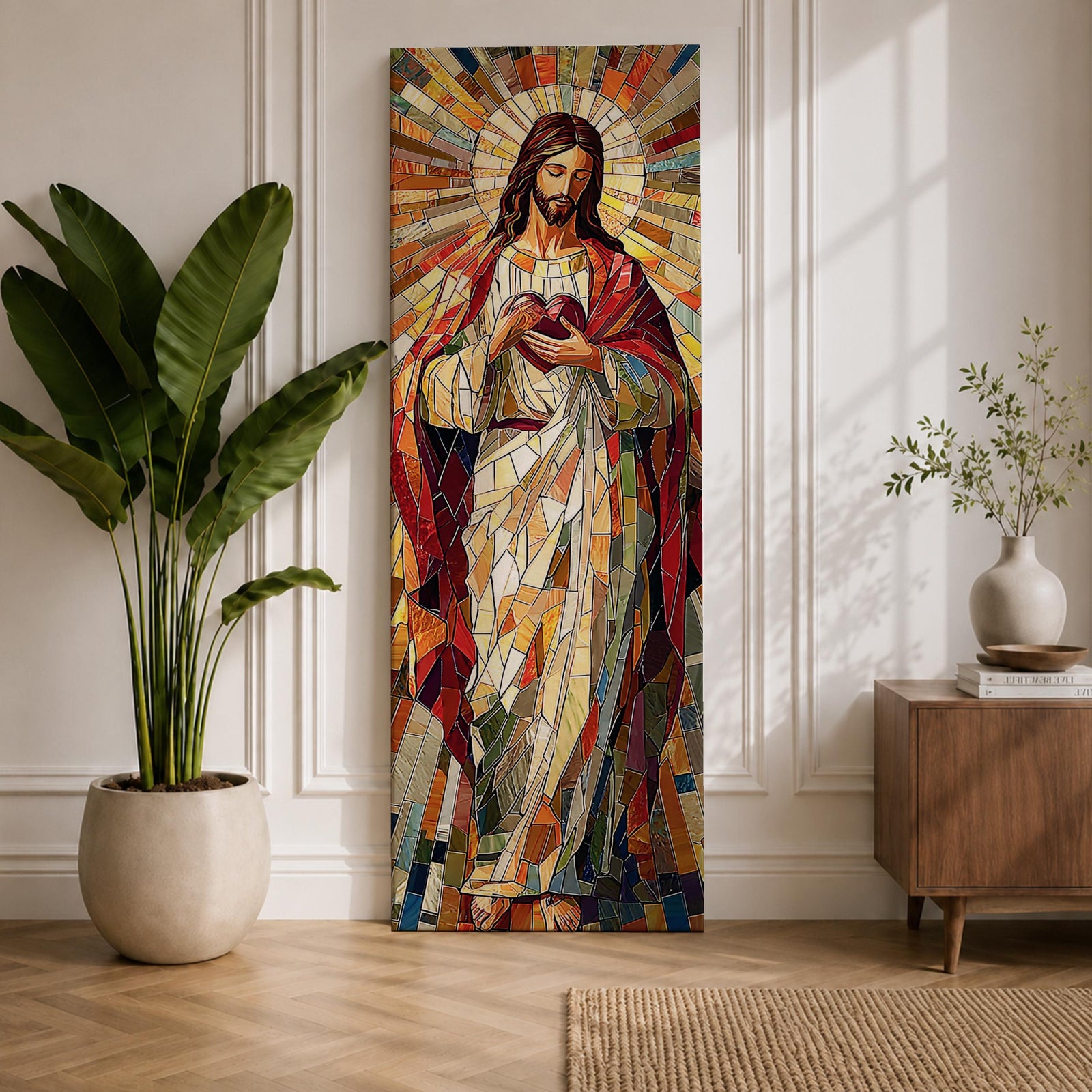 Long vertical stained glass style painting of Jesus Christ holding the Sacred Heart at his chest while radiant golden rays form a halo behind him. The figure is composed of colorful mosaic glass segments in red gold blue and white creating a luminous Christian devotional composition.