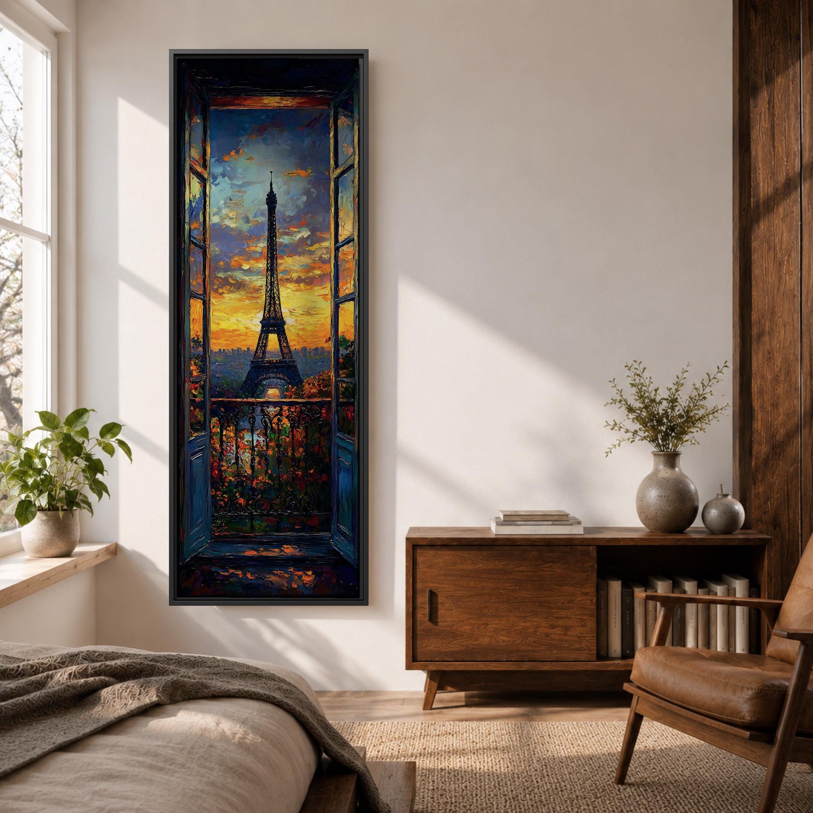 Long vertical painting of the Eiffel Tower seen through an open window with balcony railings and flowers in the foreground. A dramatic sunset sky glows with orange and blue tones above the Paris skyline while expressive brushstrokes create a romantic cityscape composition.