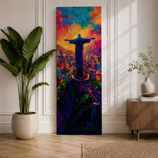 A tall vertical painting depicts Christ the Redeemer with arms outstretched overlooking a vibrant cityscape, rendered in bold expressive colors of orange, blue, pink, and purple, with textured brushstrokes and a glowing sky above, capturing a dynamic modern interpretation of the iconic statue set against a lively urban landscape.