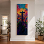 A tall vertical painting depicts Christ the Redeemer with arms outstretched overlooking a vibrant cityscape, rendered in bold expressive colors of orange, blue, pink, and purple, with textured brushstrokes and a glowing sky above, capturing a dynamic modern interpretation of the iconic statue set against a lively urban landscape.