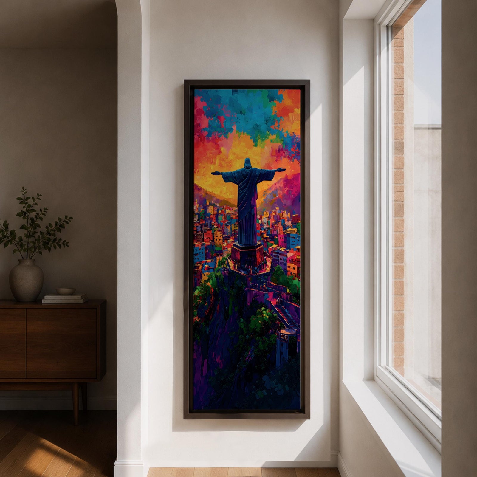 A tall vertical painting depicts Christ the Redeemer with arms outstretched overlooking a vibrant cityscape, rendered in bold expressive colors of orange, blue, pink, and purple, with textured brushstrokes and a glowing sky above, capturing a dynamic modern interpretation of the iconic statue set against a lively urban landscape.