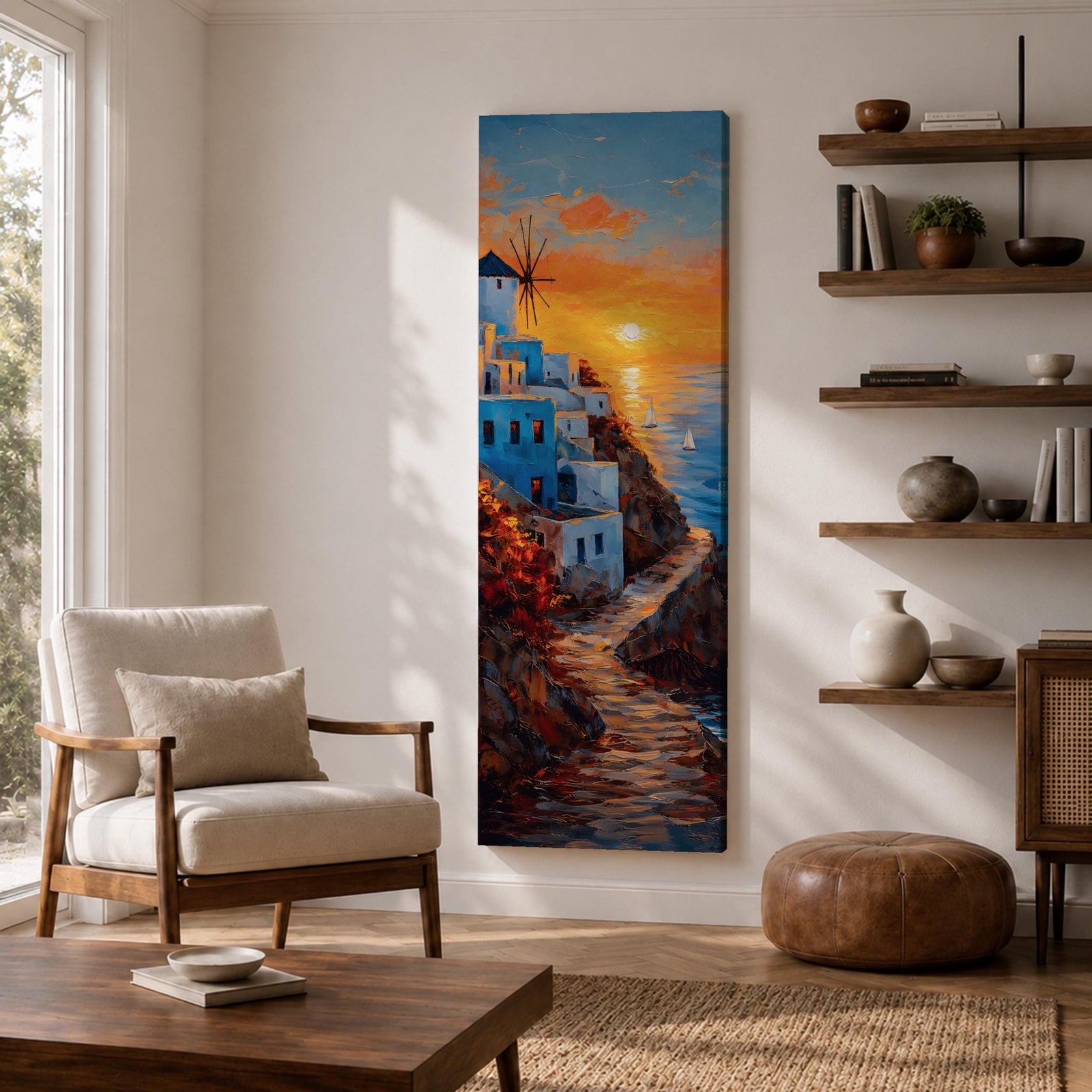 A tall vertical painting depicts a Santorini coastal scene with whitewashed buildings perched along a cliffside, a winding stone path leading toward the sea, and a glowing sunset casting warm orange and gold light across the sky and water, with a windmill silhouette and small sailboats adding depth to the vibrant Mediterranean composition.