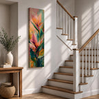 A tall vertical painting features bird of paradise flowers with elongated pointed petals in soft pink, peach, and coral tones, accented by bold green leaves and expressive layered brushstrokes, set against a blended background of pastel teal, warm yellow, and soft pink, creating a modern botanical composition with fluid movement and painterly texture.