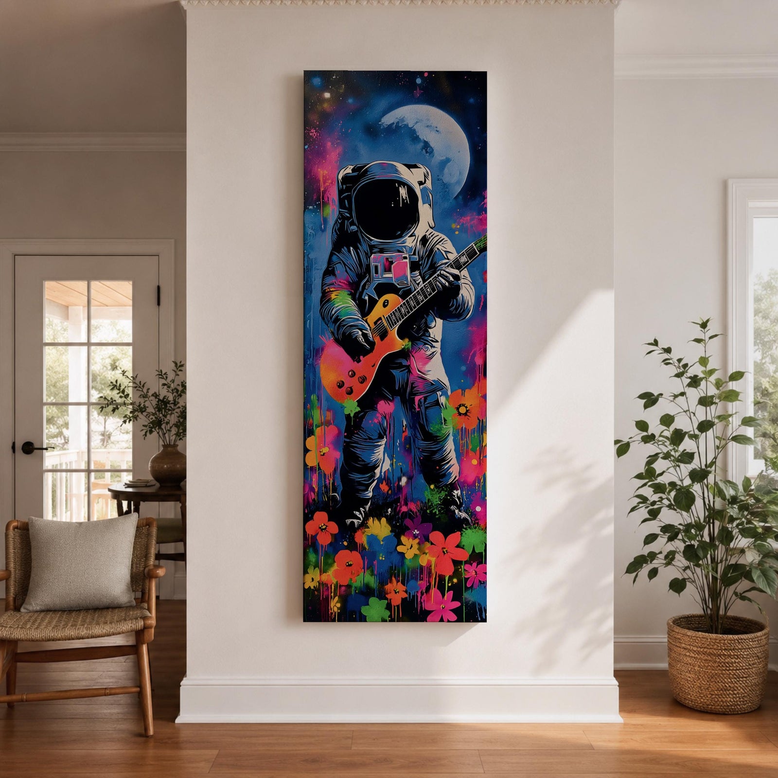 A tall vertical artwork shows an astronaut in a detailed space suit playing an electric guitar, set against a vivid cosmic backdrop with a glowing moon, deep blue sky, and splashes of neon pink, green, and orange paint, while bright flowers bloom at the base, blending surreal space imagery with street art style and bold expressive color.