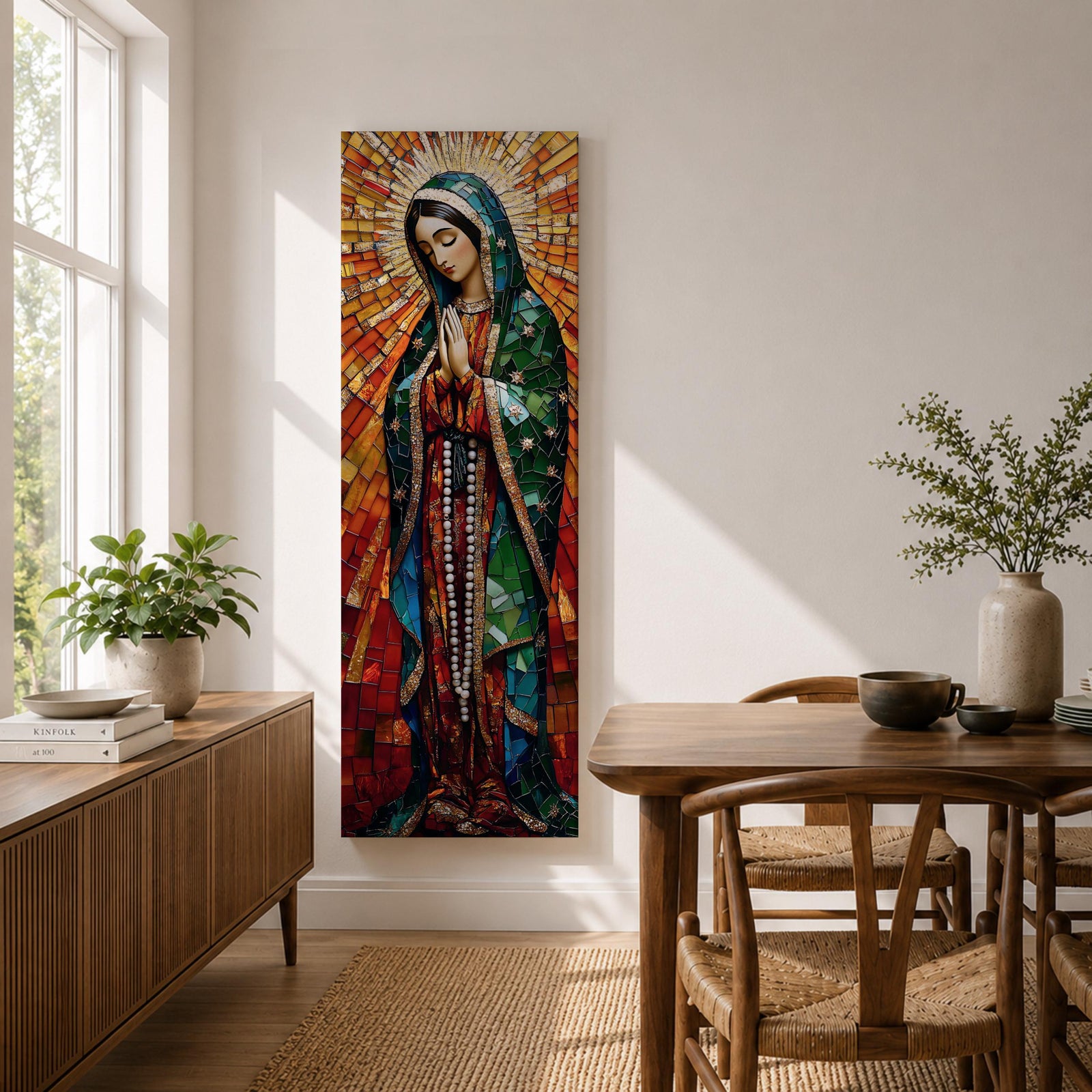 Long vertical stained glass style depiction of Our Lady of Guadalupe with hands clasped in prayer. She wears a green mantle decorated with stars and a red robe while radiant golden rays form a halo behind her, composed of colorful mosaic glass pieces forming a luminous devotional image.