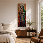 Long vertical stained glass style depiction of Our Lady of Guadalupe with hands clasped in prayer. She wears a green mantle decorated with stars and a red robe while radiant golden rays form a halo behind her, composed of colorful mosaic glass pieces forming a luminous devotional image.