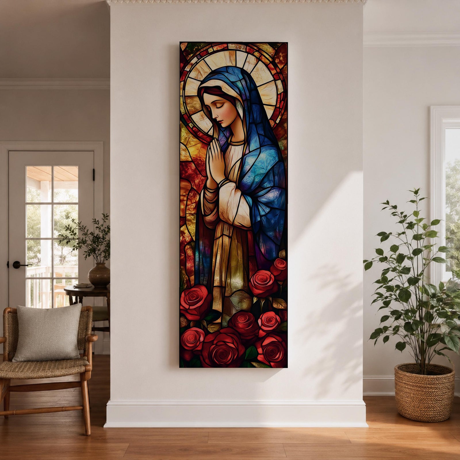 Long vertical stained glass style depiction of the Virgin Mary with hands clasped in prayer. She wears a blue mantle and cream robe while a circular halo glows behind her head and red roses bloom at her feet, all formed with colorful glass segments in a luminous devotional composition.