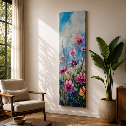 Tall vertical floral painting featuring pink and purple cosmos flowers rising from a colorful wildflower meadow against a soft blue sky. Slender stems and delicate petals sway upward in layered oil brushstrokes with vibrant garden colors including magenta, violet, yellow, and green creating a lively botanical field composition.