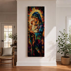 Tall vertical stained glass style artwork depicting the Virgin Mary holding baby Jesus in her arms. Mary wears a flowing blue robe and veil while the child rests peacefully against her chest. Radiating golden light forms a halo behind them with mosaic stained glass panels in deep red, blue, and amber tones.