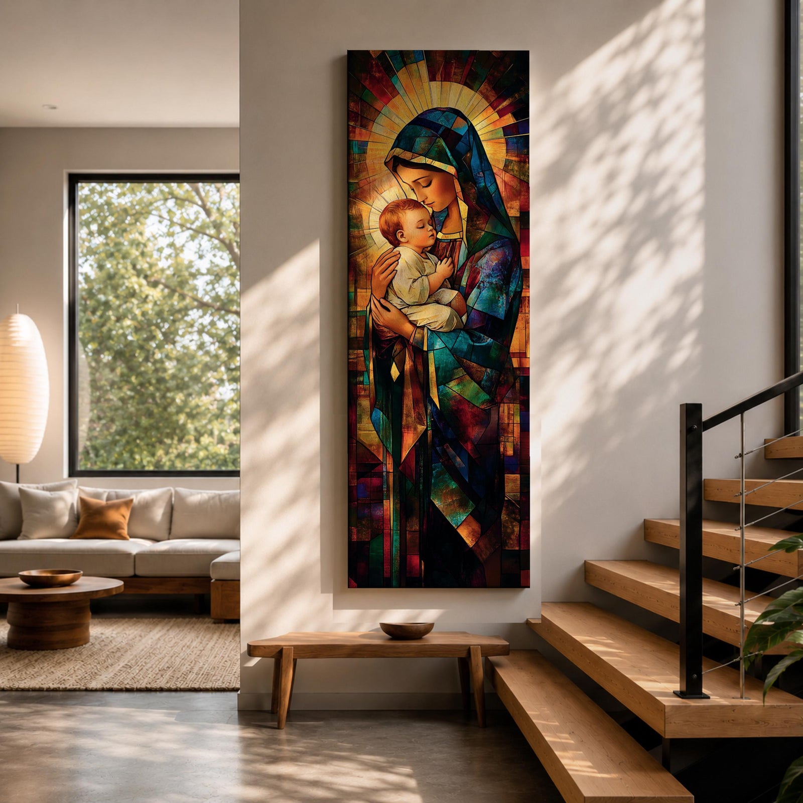 Tall vertical stained glass style artwork depicting the Virgin Mary holding baby Jesus in her arms. Mary wears a flowing blue robe and veil while the child rests peacefully against her chest. Radiating golden light forms a halo behind them with mosaic stained glass panels in deep red, blue, and amber tones.