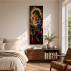 Tall vertical stained glass style artwork depicting the Virgin Mary holding baby Jesus in her arms. Mary wears a flowing blue robe and veil while the child rests peacefully against her chest. Radiating golden light forms a halo behind them with mosaic stained glass panels in deep red, blue, and amber tones.