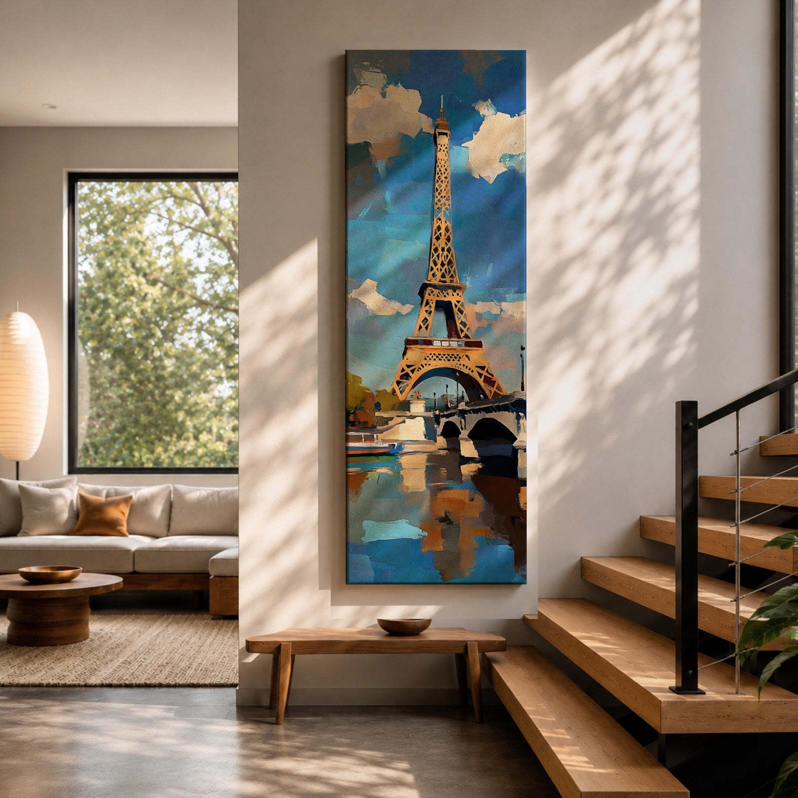 Tall vertical painting of the Eiffel Tower rising above the Seine River with a bridge spanning the water below. The tower reflects across the calm river while bright blue sky and soft clouds frame the landmark, rendered with expressive palette knife brushstrokes and bold contrasts of gold, blue, and white.