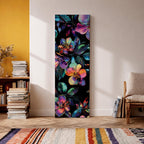 Tall vertical botanical artwork featuring glowing neon flowers in vibrant rainbow colors against a deep black background. Large luminous blossoms in pink, orange, purple, and blue are surrounded by detailed leaves, creating a modern floral composition with bold contrast and iridescent color transitions.