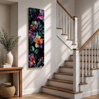 Tall vertical botanical artwork featuring glowing neon flowers in vibrant rainbow colors against a deep black background. Large luminous blossoms in pink, orange, purple, and blue are surrounded by detailed leaves, creating a modern floral composition with bold contrast and iridescent color transitions.