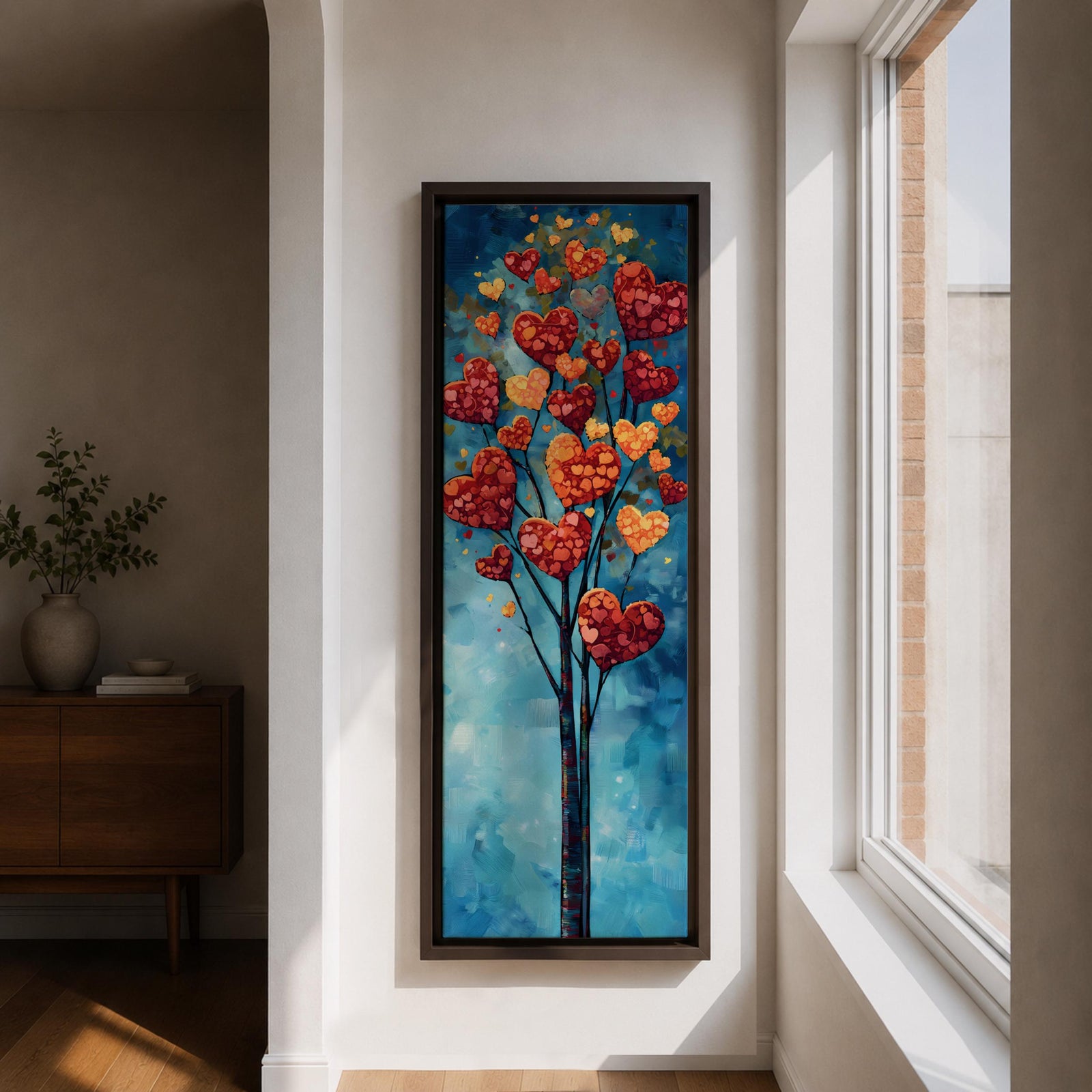 Tall vertical painting of a slender tree with branches filled with red and golden heart shaped leaves rising upward against a soft blue sky. The hearts cluster like blossoms along thin dark branches creating a romantic nature inspired composition with layered painterly textures.
