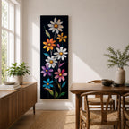 Tall vertical floral artwork featuring colorful daisy flowers in white, orange, purple, pink, and blue rising along slender green stems against a deep black background. The composition highlights bright petals and yellow centers with smooth painterly details and vibrant botanical contrast.