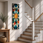 Tall vertical geometric artwork featuring an Islamic mosaic pattern with an eight pointed star at the center. Interlocking shapes in teal, blue, white, orange, and gold form symmetrical Moorish tile motifs with a decorative arabesque structure inspired by traditional Islamic architecture.