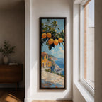 Tall vertical Mediterranean coastal painting showing bright yellow lemons hanging from a leafy branch above an Amalfi seaside village. Colorful Italian buildings sit along a cliffside path overlooking deep blue ocean waters beneath a sunny sky.