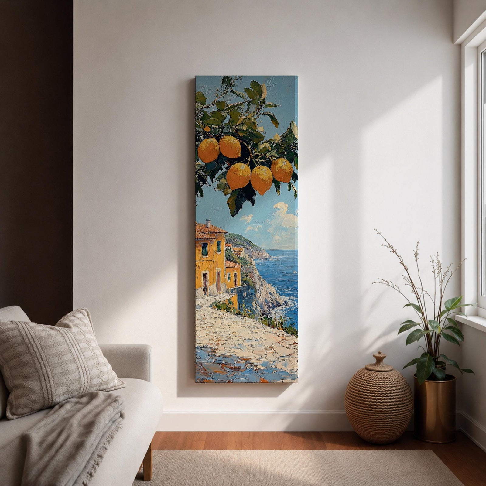 Tall vertical Mediterranean coastal painting showing bright yellow lemons hanging from a leafy branch above an Amalfi seaside village. Colorful Italian buildings sit along a cliffside path overlooking deep blue ocean waters beneath a sunny sky.