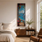 Tall vertical coastal painting showing an Italian ocean view framed by an open doorway with pink flowers and potted plants. The bright Mediterranean sea stretches toward rocky cliffs and a distant sailboat beneath a clear blue sky.