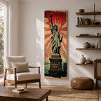 Long vertical retro poster style artwork featuring the Statue of Liberty standing on her pedestal holding the torch high with a tablet in her arm. Bold red sunburst rays radiate behind the monument while distressed textures and muted green tones create a vintage propaganda inspired illustration of the iconic New York landmark.