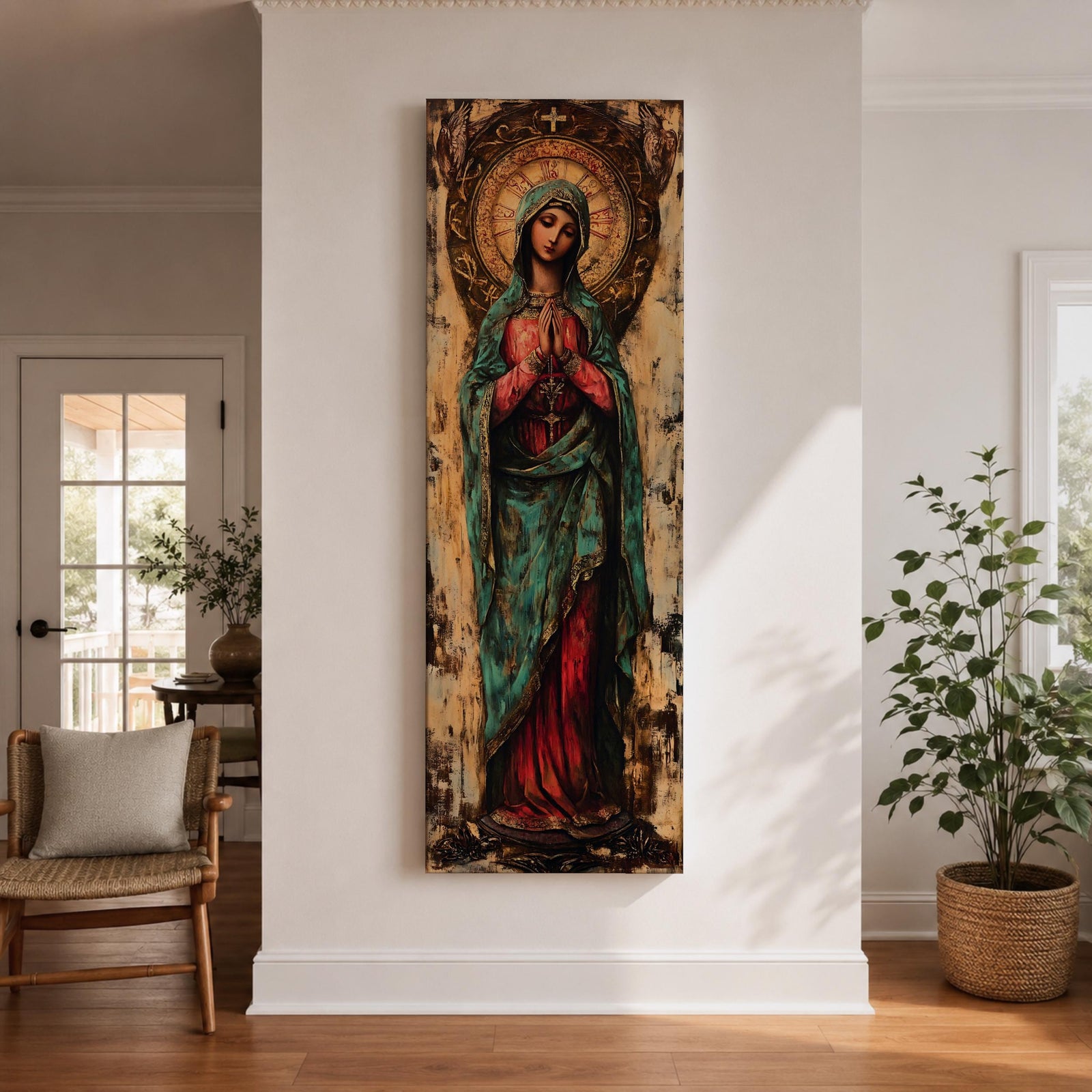Long vertical painting of the Virgin Mary standing with hands clasped in prayer, wearing a deep red robe and teal mantle. An ornate circular golden halo with sacred symbols forms a radiant backdrop while textured brushwork and aged tones create a traditional Catholic devotional icon style composition.