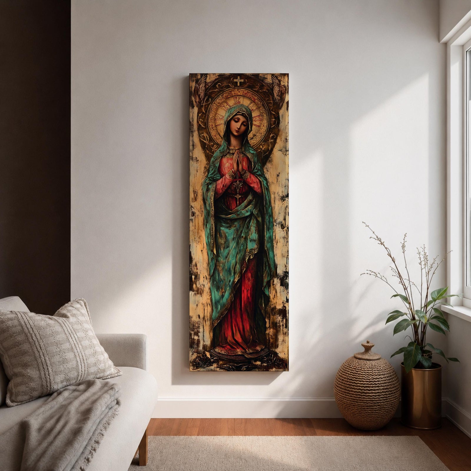 Long vertical painting of the Virgin Mary standing with hands clasped in prayer, wearing a deep red robe and teal mantle. An ornate circular golden halo with sacred symbols forms a radiant backdrop while textured brushwork and aged tones create a traditional Catholic devotional icon style composition.