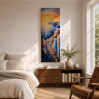 Long vertical painting of a Santorini coastal village with whitewashed buildings and a blue dome church overlooking the sea at sunset. A stone pathway descends between bright white walls toward the shoreline while golden sunlight reflects across calm water and warm clouds fill the sky.