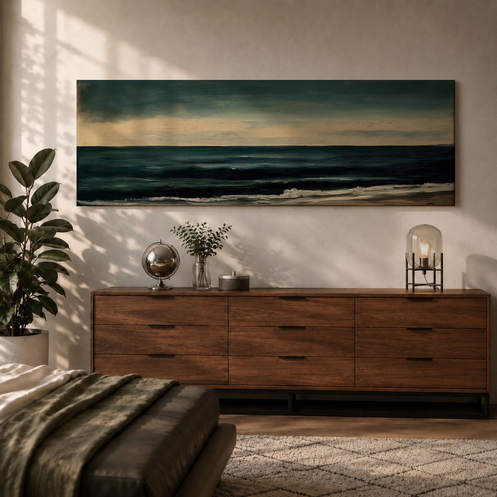 Panoramic seascape painting showing dark rolling waves beneath a dramatic cloudy sky with faint light breaking along the distant horizon. Deep teal and navy tones blend across the water while textured brushstrokes form soft foam along the shoreline, creating a moody minimalist coastal composition across the wide horizontal canvas.