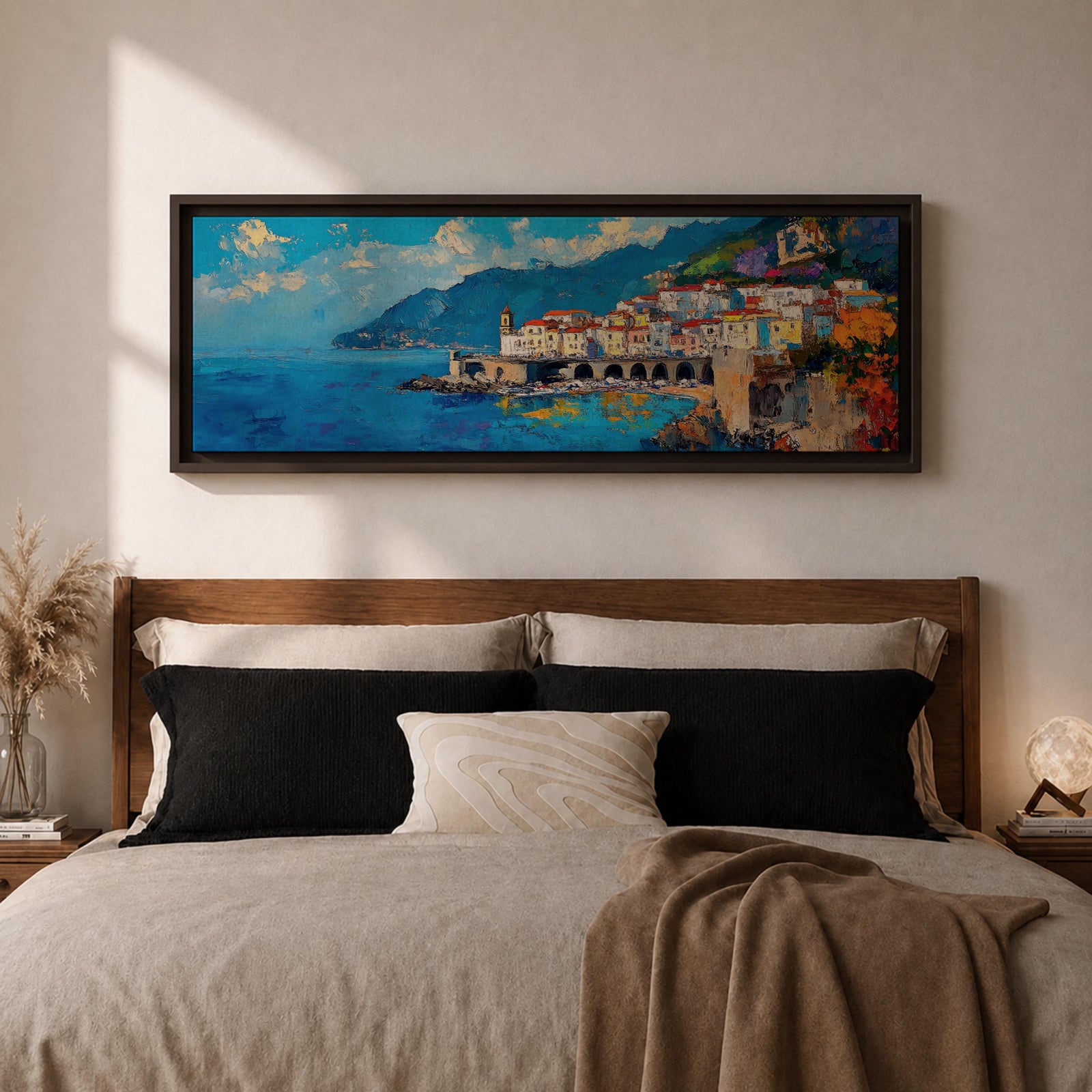 Panoramic Mediterranean coastal painting of the Amalfi Coast featuring colorful hillside houses overlooking bright blue sea. A stone harbor with arches and boats sits along the shoreline while mountains rise in the background beneath a clear sky with scattered clouds across the wide horizontal seaside composition.