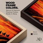 Panoramic desert sunset painting featuring a silhouette caravan of camels and riders walking along rolling sand dunes beneath a glowing red and orange sky. The low sun sits near the horizon while layered desert dunes stretch into the distance, creating a dramatic wide composition across the desert landscape.