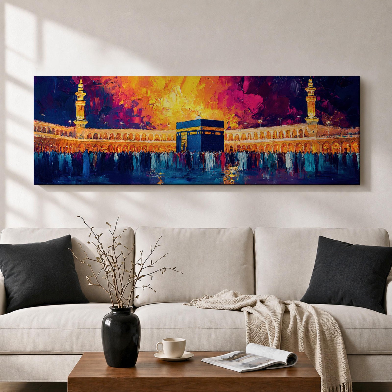 Panoramic painting of the Kaaba at Masjid Al Haram in Mecca surrounded by worshippers within the illuminated mosque courtyard. Tall minarets rise on either side while glowing sunset colors of gold, magenta, and deep blue fill the sky above the sacred Islamic landmark across the wide horizontal composition.