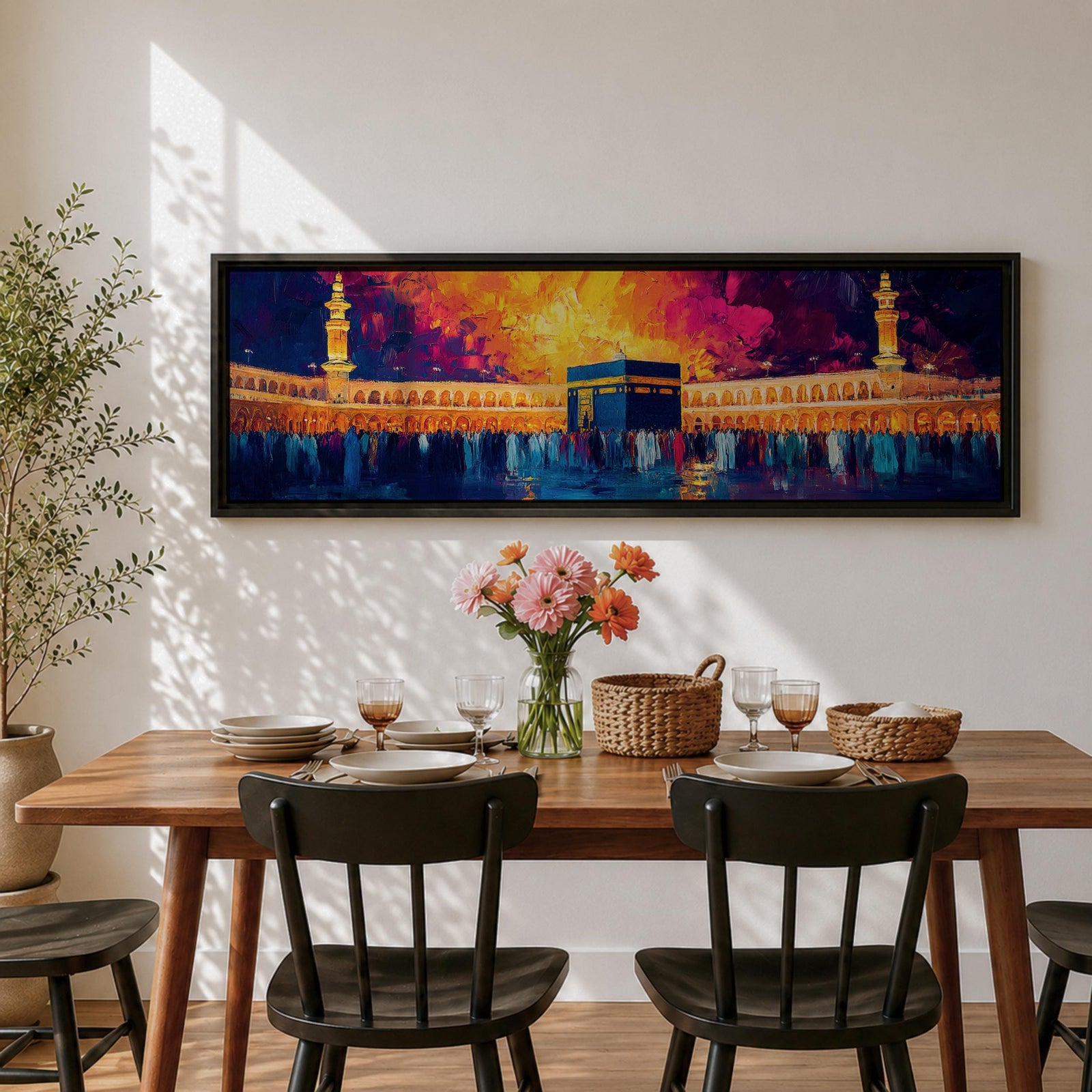 Panoramic painting of the Kaaba at Masjid Al Haram in Mecca surrounded by worshippers within the illuminated mosque courtyard. Tall minarets rise on either side while glowing sunset colors of gold, magenta, and deep blue fill the sky above the sacred Islamic landmark across the wide horizontal composition.