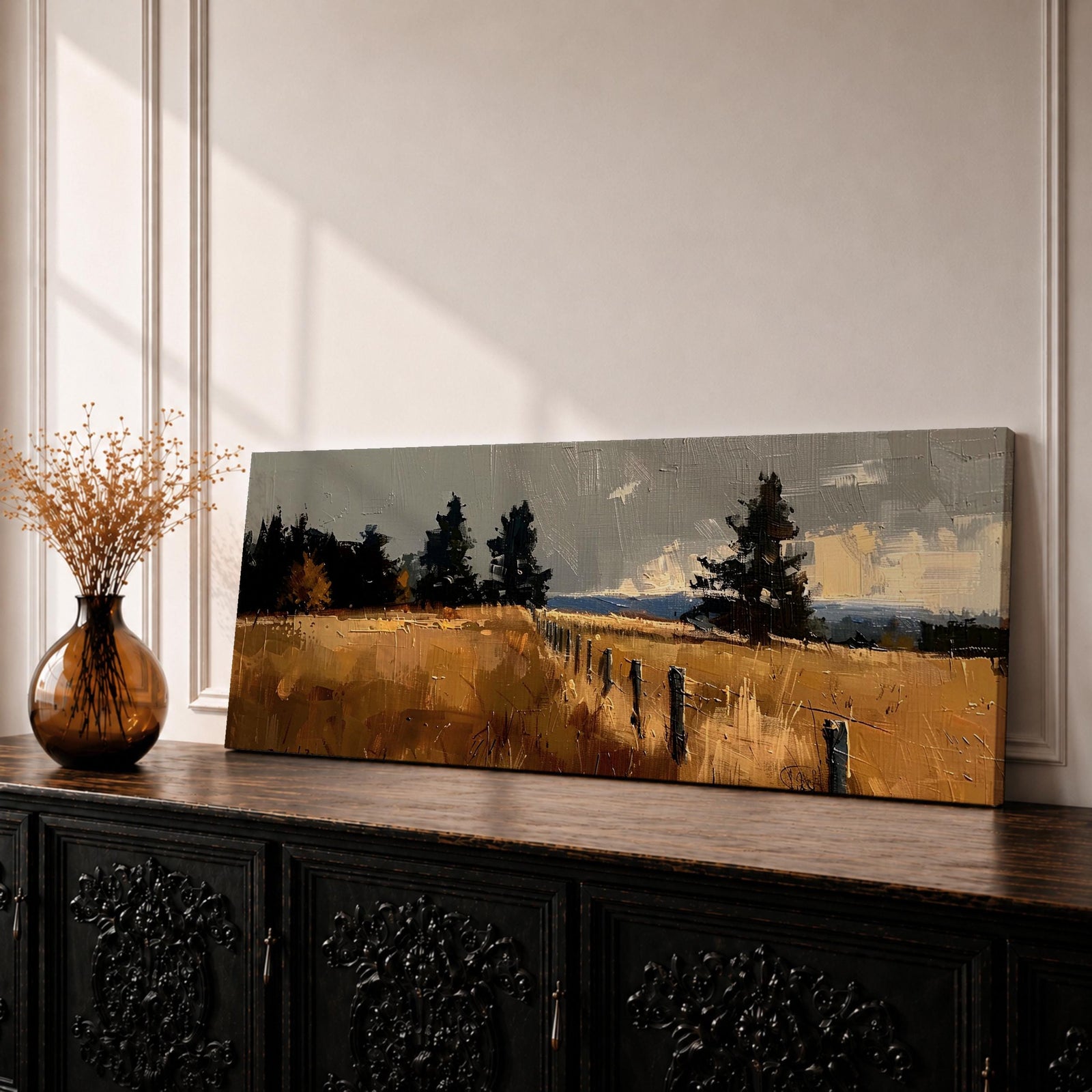 Panoramic countryside landscape painting featuring golden rural fields with a rustic fence line stretching into the distance. Textured brushstrokes depict tall grasses and scattered trees beneath a muted cloudy sky, with distant hills fading along the horizon across a wide pastoral farmland scene.