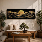 Panoramic moonlit mountain landscape painting featuring layered black mountains outlined with flowing gold lines beneath a glowing full moon. Soft golden clouds drift across a dark sky while ridges and valleys unfold across the wide composition, creating a dramatic celestial scene with textured metallic accents.