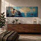 Panoramic Mediterranean coastal painting showing white cliffside houses overlooking deep blue sea at sunset. A sailboat drifts across calm water while sunlight reflects across the horizon and textured brushstrokes form dramatic rocky cliffs and coastal architecture in the wide horizontal seaside composition.