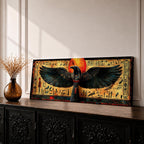 Panoramic ancient Egyptian style artwork featuring the falcon headed god Horus with wide outstretched wings beneath a glowing red sun disk. Hieroglyphic symbols and figures frame the composition while textured gold and dark tones highlight the wings and central deity across the wide symmetrical scene.