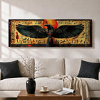 Panoramic ancient Egyptian style artwork featuring the falcon headed god Horus with wide outstretched wings beneath a glowing red sun disk. Hieroglyphic symbols and figures frame the composition while textured gold and dark tones highlight the wings and central deity across the wide symmetrical scene.