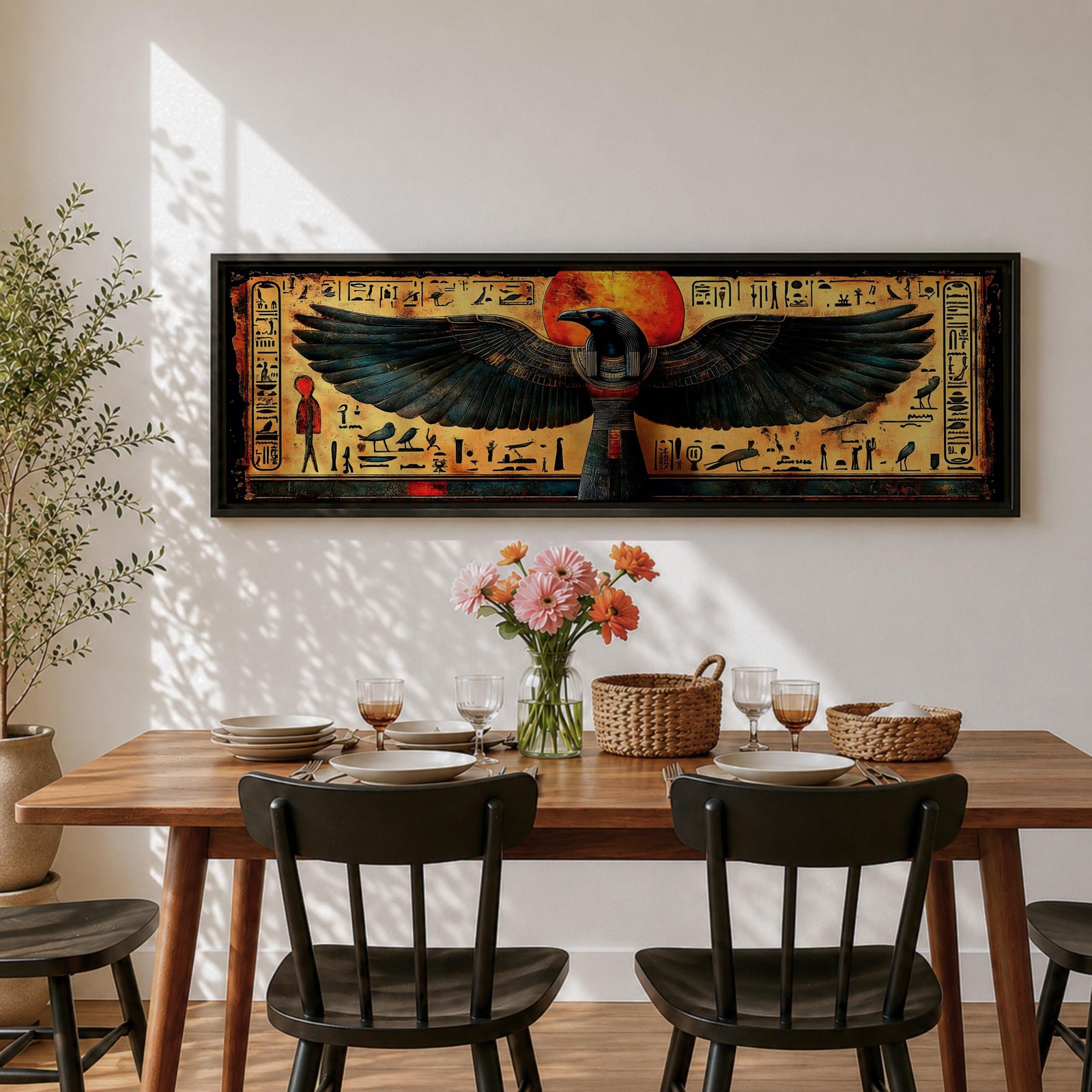 Panoramic ancient Egyptian style artwork featuring the falcon headed god Horus with wide outstretched wings beneath a glowing red sun disk. Hieroglyphic symbols and figures frame the composition while textured gold and dark tones highlight the wings and central deity across the wide symmetrical scene.